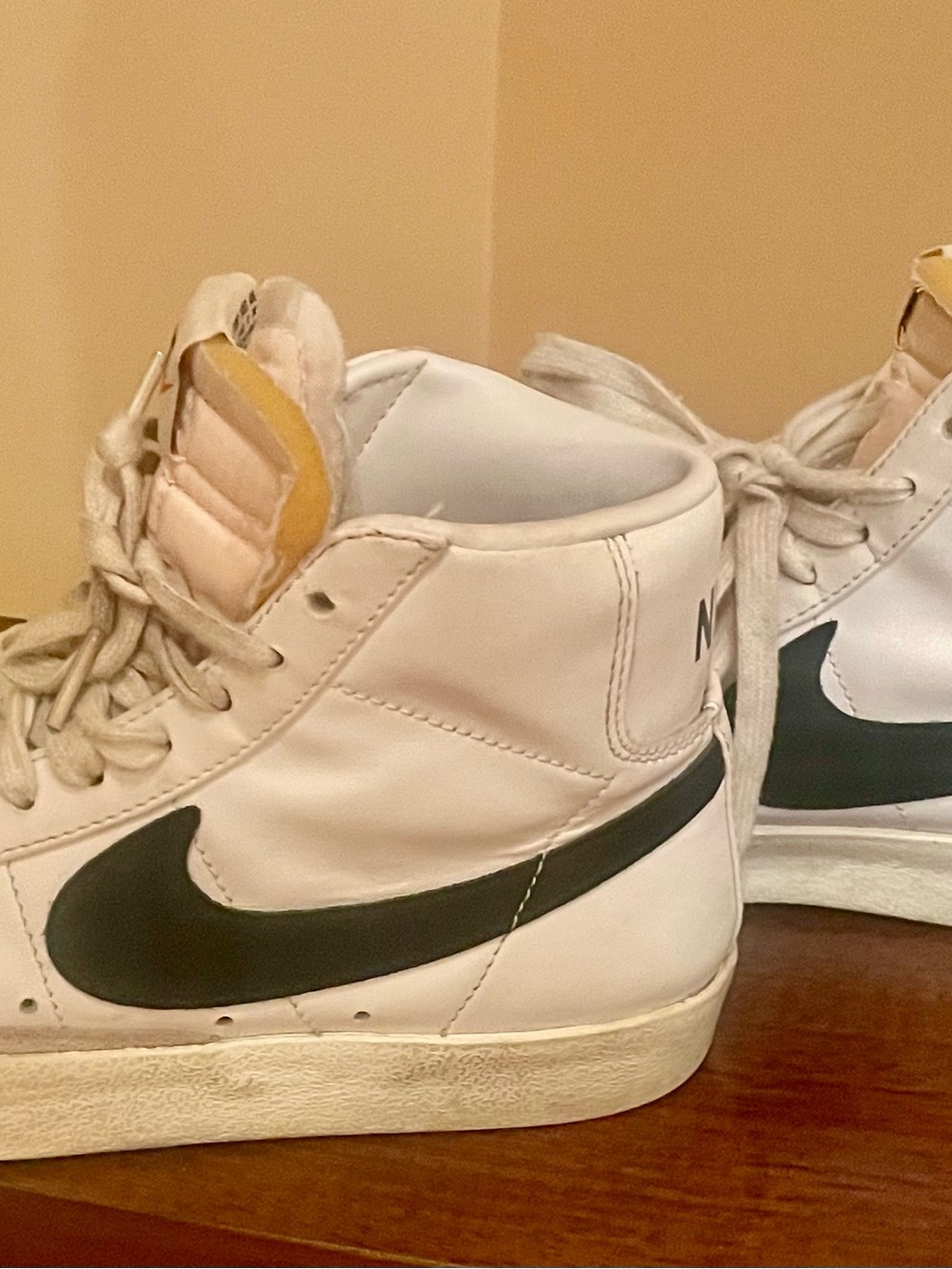 Nike White High-Top Sneakers with Black Swoosh